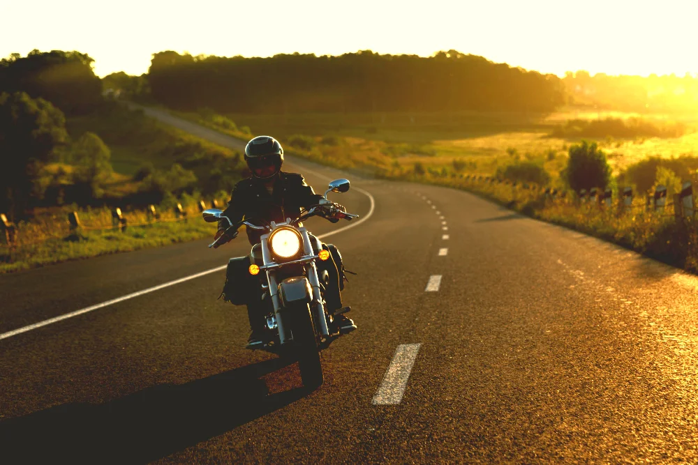 A man speeding on a motorbike