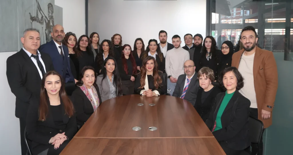 Advantage Solicitors - team posing to the camera everyone looks happy